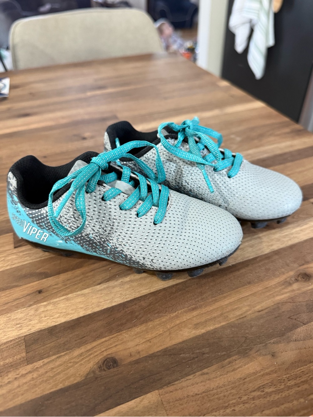 Kids Soccer Cleats in Light Gray with Teal Accents